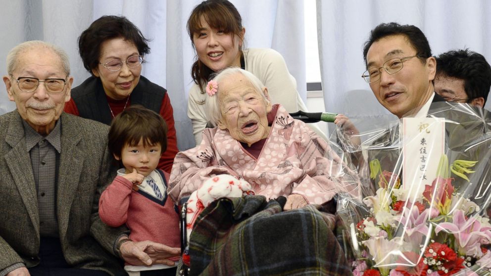 PHOTO: Misao Okawa poses with her relatives and Ward Mayor Takehiro Ogura as she is celebrated at a nursing home in Osaka, Japan on March 4, 2015, one day before her 117th birthday.