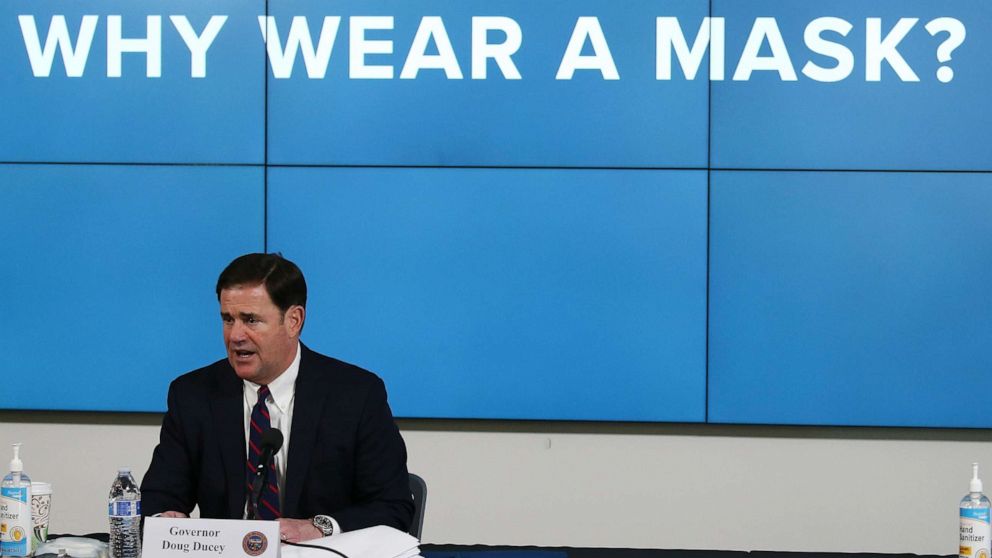 PHOTO: In this Thursday, July 9, 2020, photo, Arizona Republican Gov. Doug Ducey speaks about the latest coronavirus update in Arizona and benefits of wearing a mask during a news conference in Phoenix. 