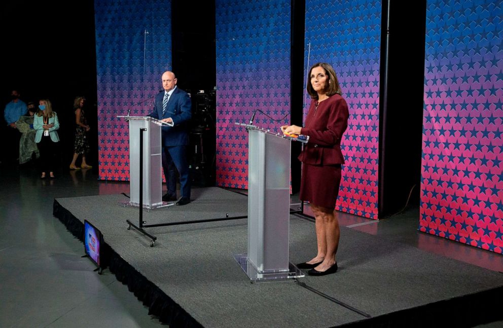 PHOTO: Sen. Martha McSally and Democratic challenger Mark Kelly are separated by plexiglass as they participate in a debate at the Walter Cronkite School of Journalism at Arizona State University in Phoenix, Oct. 6, 2020.