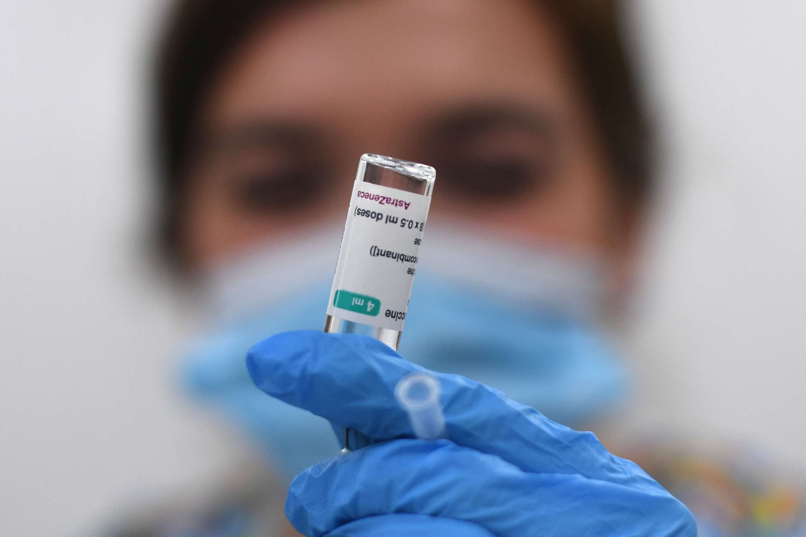 PHOTO: A health worker prepares a dose of the AstraZeneca/Oxford vaccine at a coronavirus vaccination center at the Fazl Mosque in southwest London on March 23, 2021.