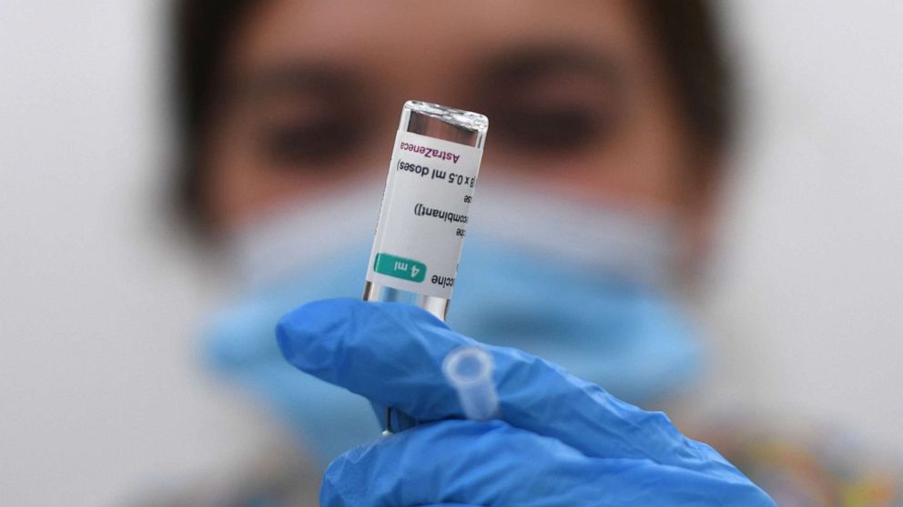 PHOTO: A health worker prepares a dose of the AstraZeneca/Oxford vaccine at a coronavirus vaccination center at the Fazl Mosque in southwest London on March 23, 2021.