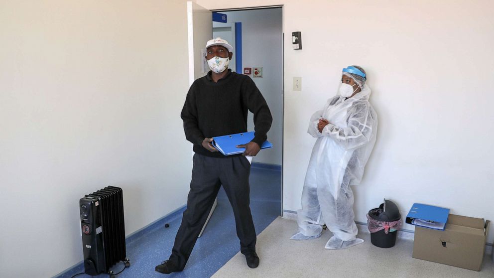PHOTO: A health worker looks on as a vaccine trial volunteer arrives to take part in the country's human clinical trial for potential vaccines at the Wits RHI Shandukani Research Centre in Johannesburg, Aug. 27, 2020.