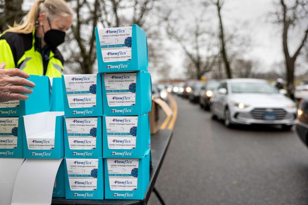 PHOTO: Residents line up at a drive-up distribution site to receive free at-home COVID-19 test kits, Jan. 2, 2022, in Stamford, Connecticut.