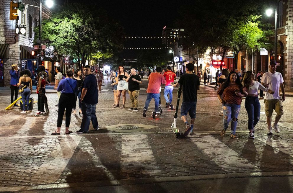 PHOTO: People gather on Sixth Street at night in downtown Austin, Texas, May 23, 2020.