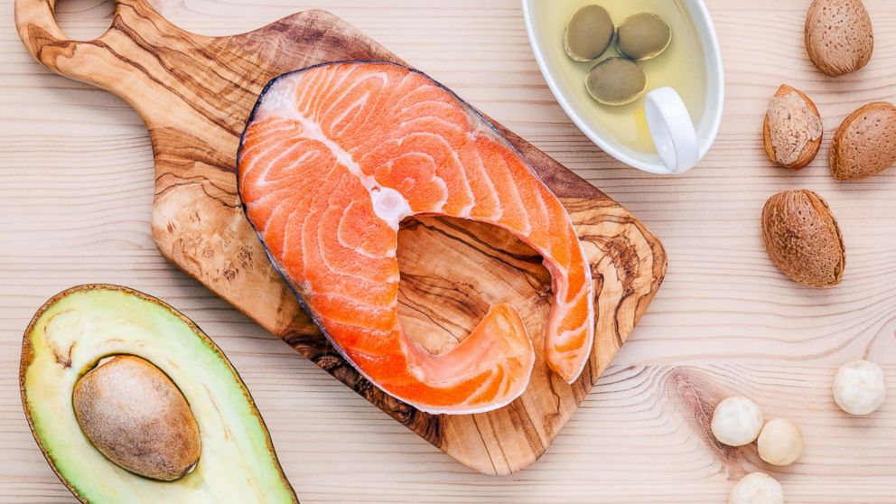 A selection of food sources of Omega-3 and unsaturated fats including various nuts, olive oil, salmon and avocado are pictured in an undated stock photo.
