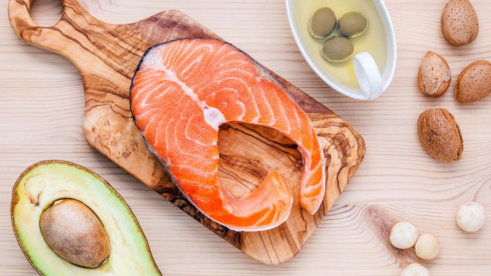 PHOTO: A selection of food sources of Omega-3 and unsaturated fats including various nuts, olive oil, salmon and avocado are pictured in an undated stock photo.