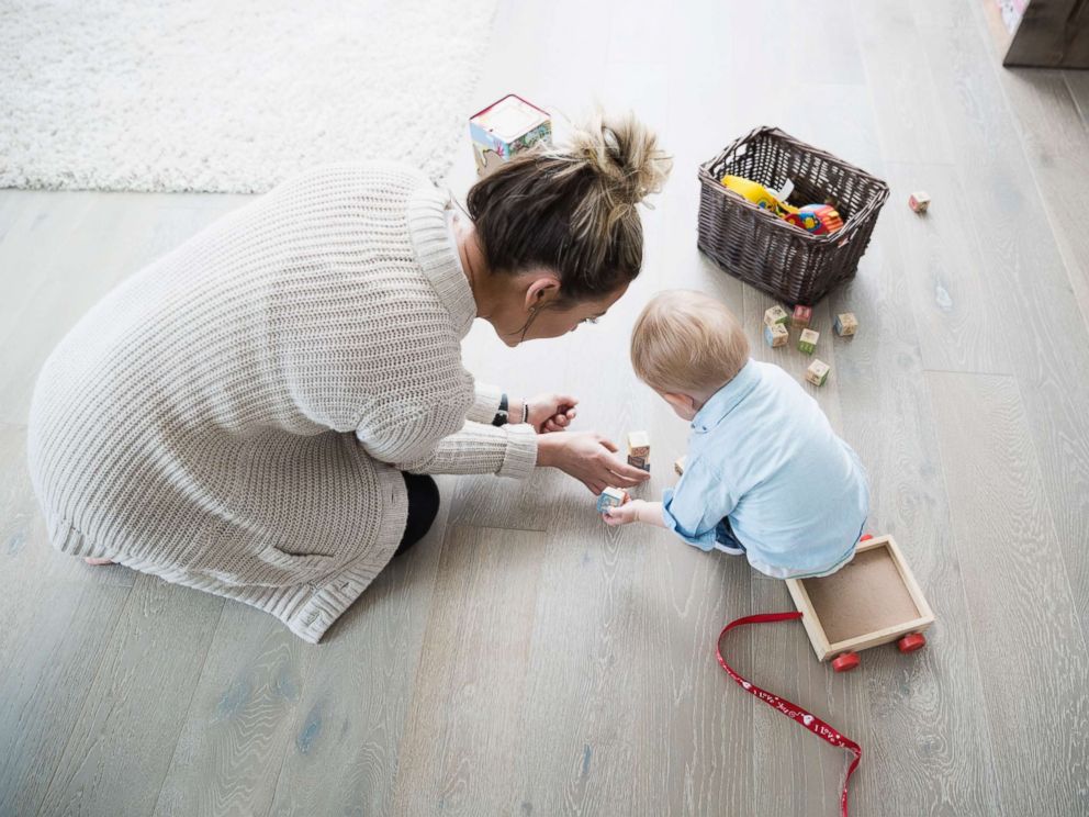 PHOTO: Mother and baby son playing with wood blocks in an undated stock photo.