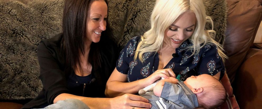 PHOTO: Bliss and Ashleigh Coulter hold their son Stetson, the first person carried by both mothers during pregnancy.