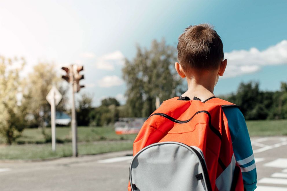 toddler wearing backpack