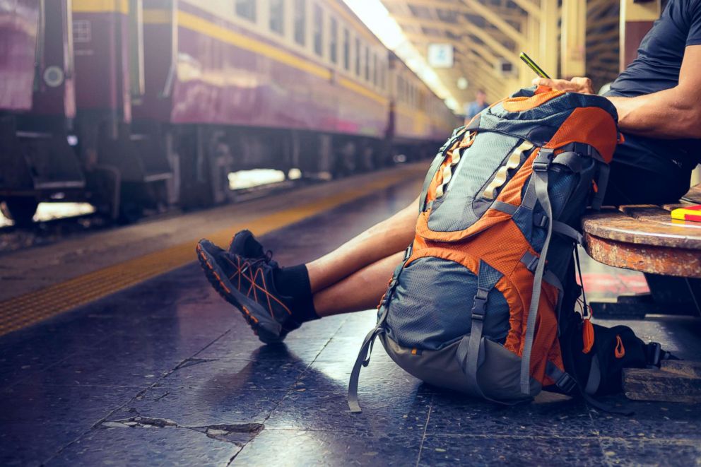 PHOTO: This stock image depicts a tourist with a backpack waiting for a train.