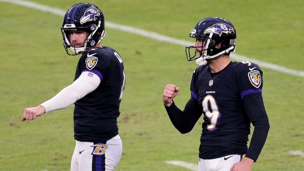 PHOTO: Punter Sam Koch, left, and kicker Justin Tucker of the Baltimore Ravens celebrate after Tucker kicked a game tying field goal against the Tennessee Titans, Nov. 22, 2020, in Baltimore, Maryland.
