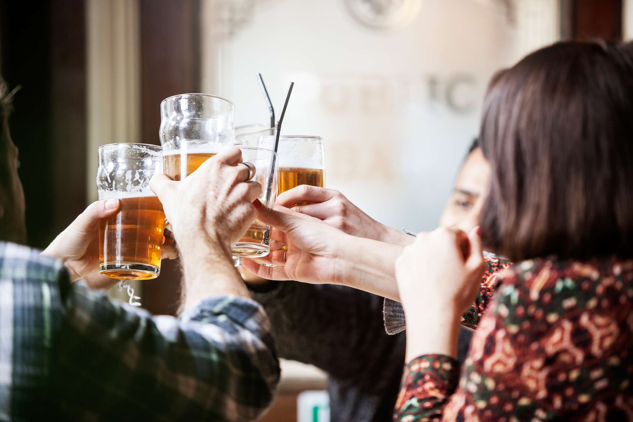 PHOTO: People toast with beer mugs at a pub in an undated stock photo.