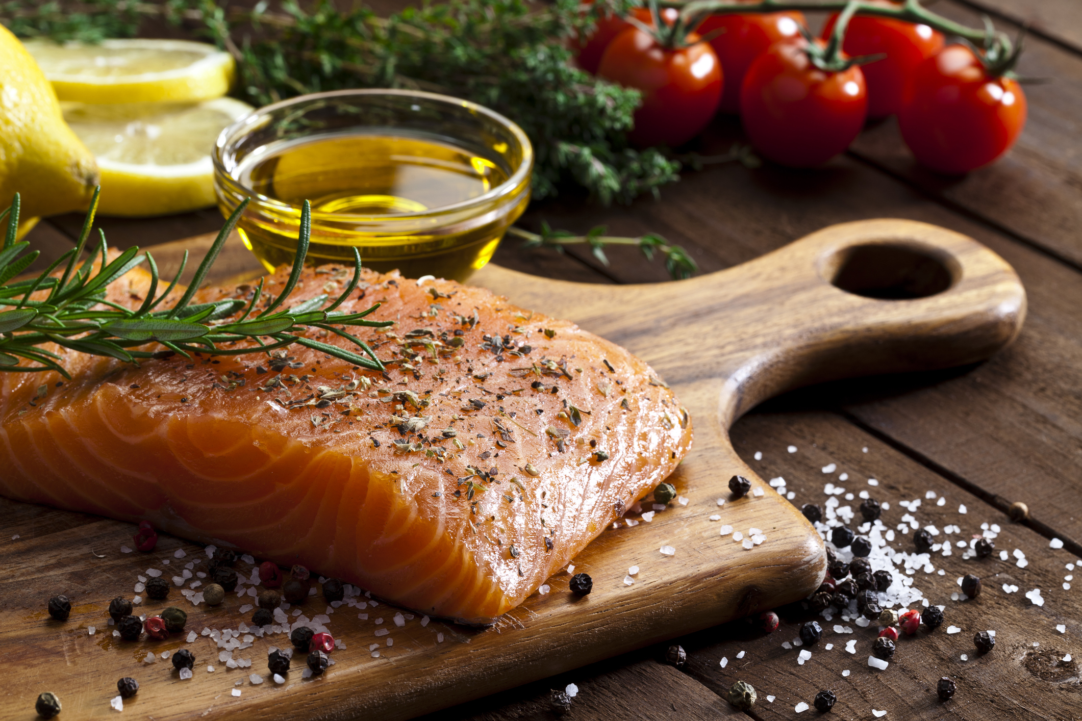 PHOTO: A salmon steak and olive oil are being prepared for cooking in this stock image. 