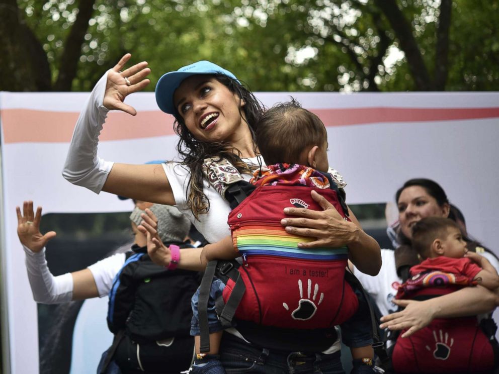 PHOTO: Mothers carrying their children perform during the Big Latch On breastfeeding festival held at the Bonatic Garden of the Chapultepec Park in Mexico City on Aug. 5, 2017.