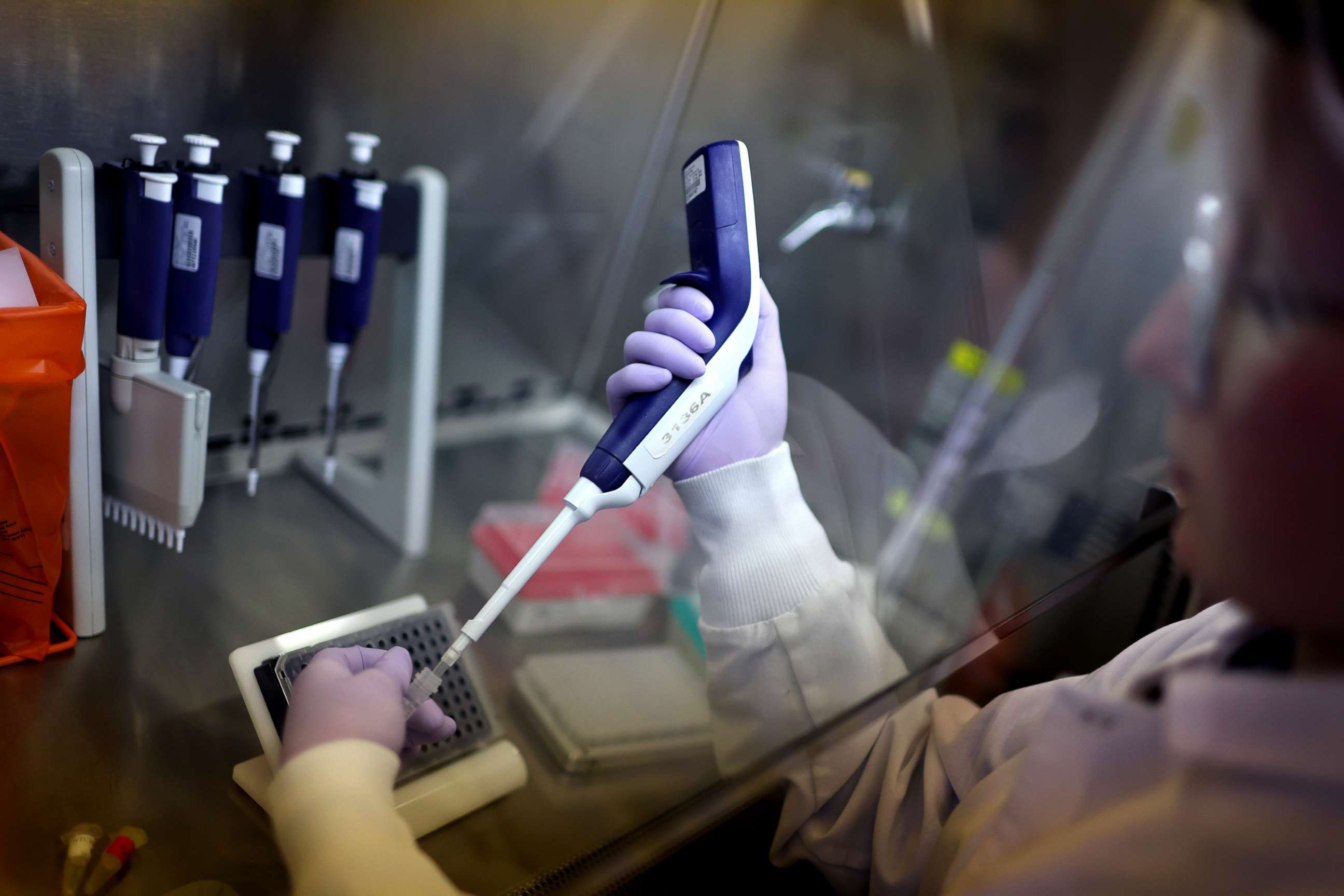 PHOTO: Microbiologist Anne Vandenburg-Carroll tests poultry samples for the presence of avian influenza, or bird flu, at the University of Wisconsin-Madison's Veterinary diagnostics lab in Madison, Wis., March 24, 2022. 