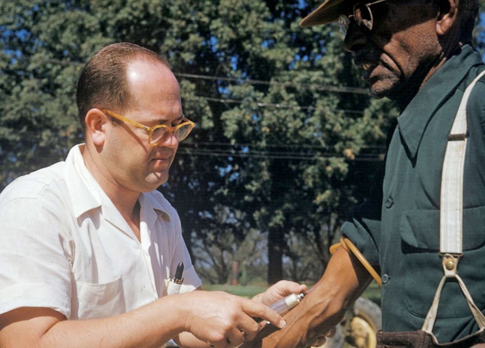 PHOTO: In this file photo released by the National Archives, a black man included in a syphilis study has blood drawn by a doctor in Tuskegee, Ala., 1950s.