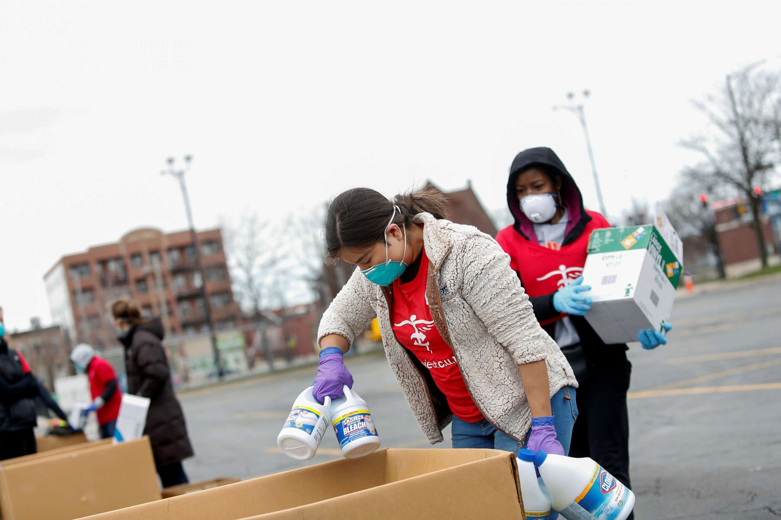 PHOTO: Volunteers with Project C.U.R.E. accept bleach and protective equipment (PPE) from a motorist to be donated to healthcare workers treating coronavirus disease (COVID-19) in Chicago, March 29, 2020. 