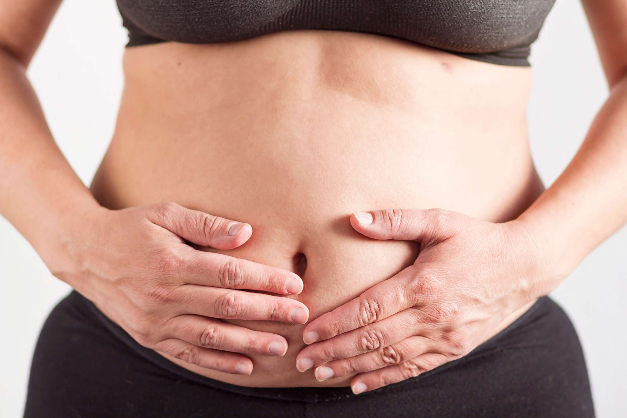 PHOTO: A woman holds her stomach in an undated stock photo.