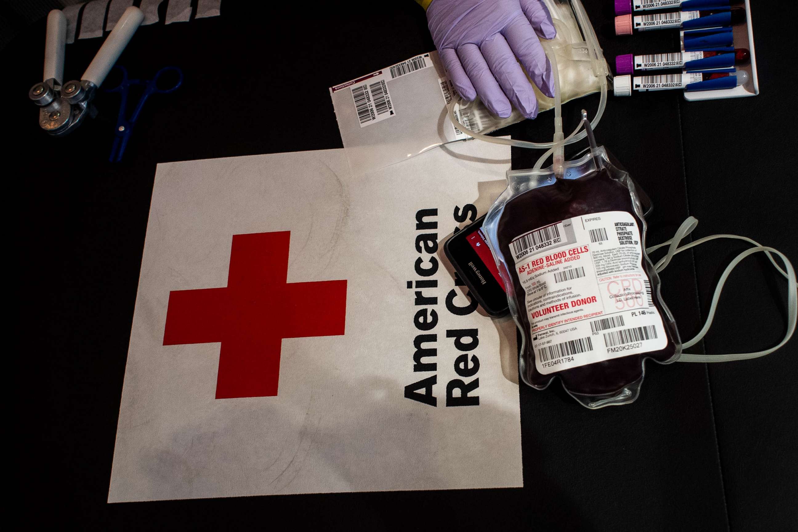 PHOTO: In this March 23, 2021 file photo Phlebotomist Adel Velasco prepares a blood donation at a Red Cross blood drive with L.A. Care Health Plan in Los Angeles.