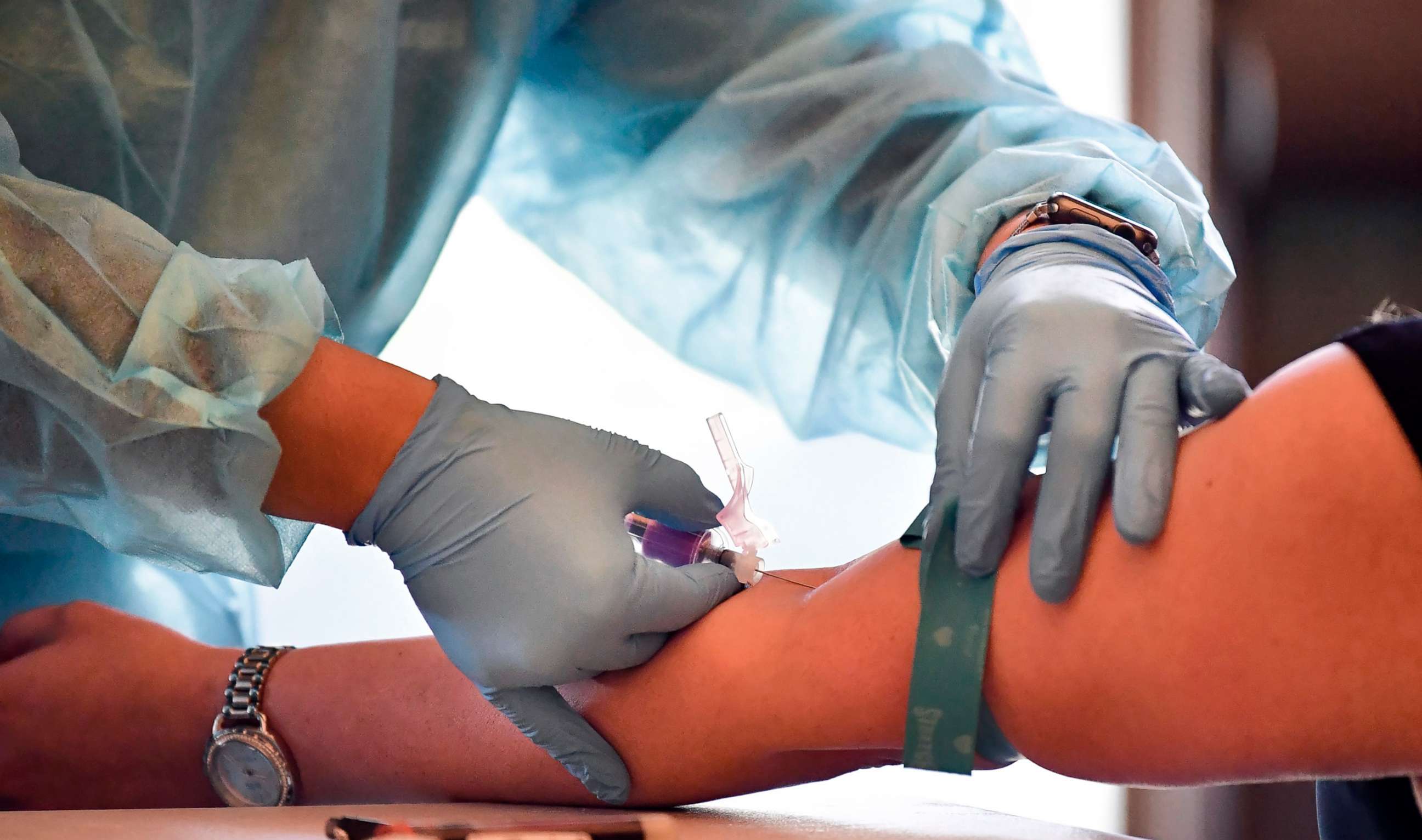 PHOTO: A phlebotomist draws blood in Pico Rivera, Calif., Feb. 17, 2021.