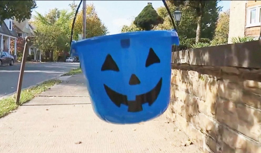 PHOTO: Blue buckets will be carried this Halloween for autism awareness.