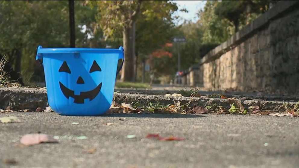 PHOTO:  Blue buckets will be carried this Halloween for autism awareness.