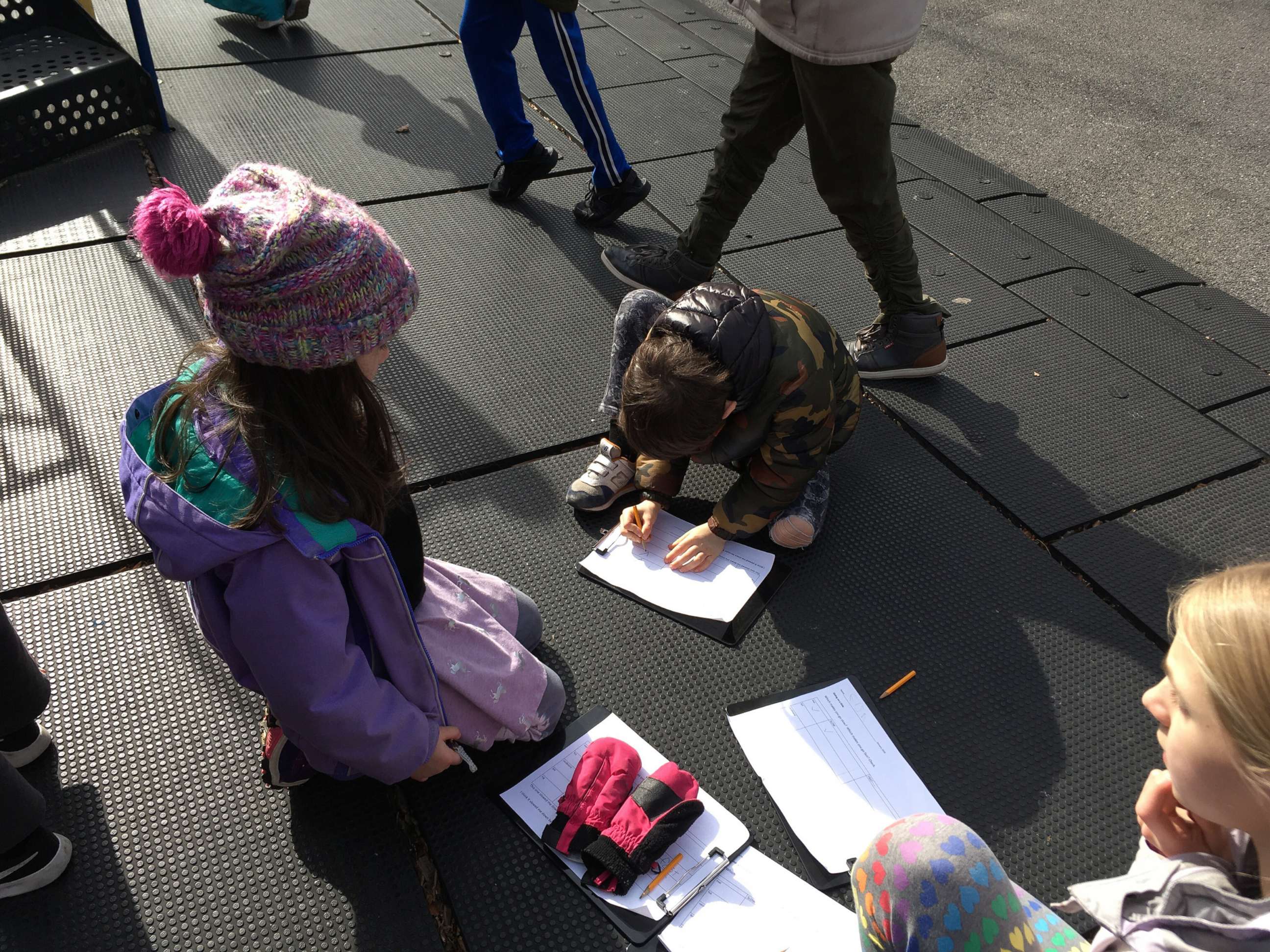 PHOTO: Students at Brooklyn New School work on a physics study in a playground near the school in Brooklyn, New York.