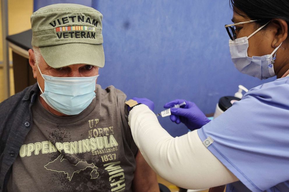 PHOTO: Latha Augusthy administers a second COVID-19 booster shot to Army veteran Jerry Koch at Edward Hines Jr. VA Hospital, April 1, 2022, in Hines, Ill.