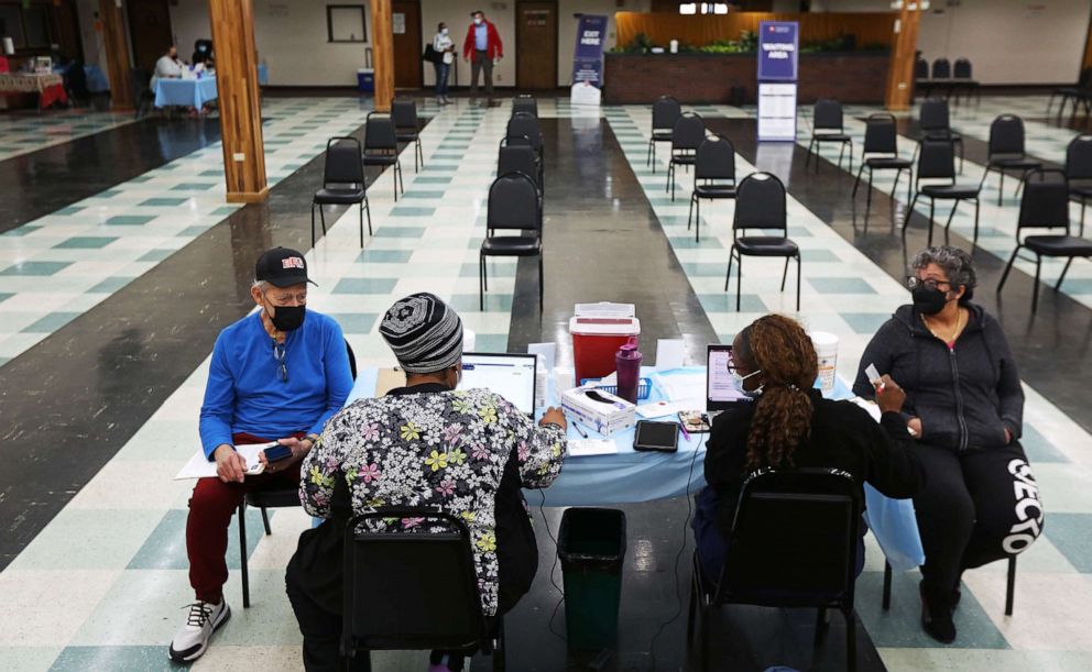 PHOTO: Patients wait to receive their second boosters at a COVID-19 testing and vaccination site at the Harvard Street Neighborhood Health Center in Boston, April 5, 2022.