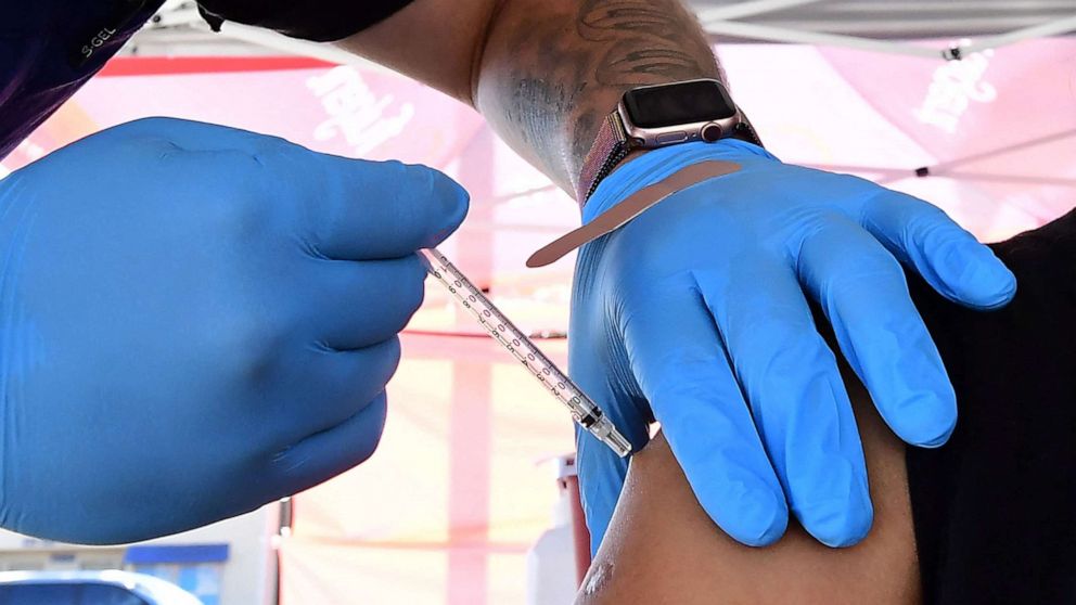 PHOTO: The Pfizer Covid-19 vaccine is administered at a pop-up clinic offering vaccines and booster shots in Rosemead, California on Nov. 29, 2021.