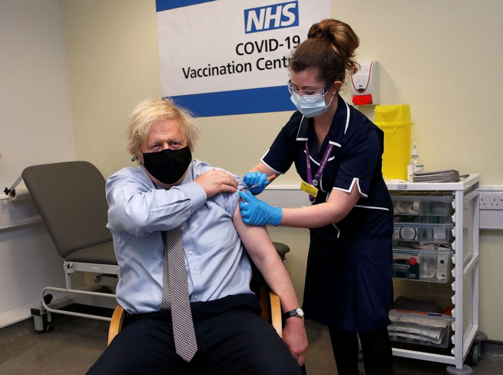 PHOTO: Britain's Prime Minister Boris Johnson receives a dose of a AstraZeneca/Oxford Covid-19 vaccine, administered by nurse and Clinical Pod Lead, Lily Harrington, at St Thomas' Hospital in London, March 19, 2021.