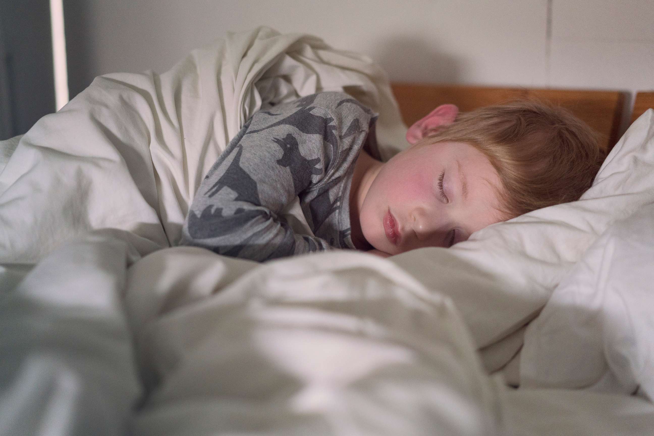 PHOTO: A young boy sleeps in bed in an undated stock photo.