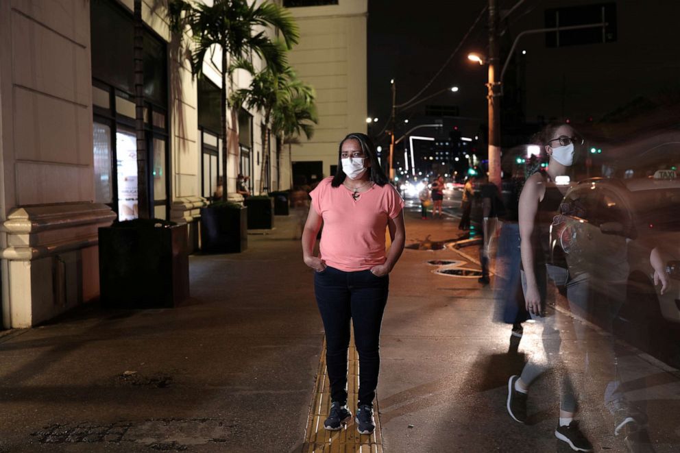 PHOTO: Antonia da Silva Cruz Santos, 48, a nurse and volunteer in COVID-19 vaccine trial for AstraZeneca, poses for a photograph in Sao Paulo, Brazil, Dec. 08, 2020.