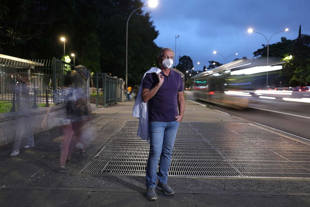 PHOTO: COVID-19 trial vaccine volunteer Luiz Augusto Menegazzo, 65, a doctor, poses for a photograph in Sao Paulo, Brazil, Dec. 04, 2020.