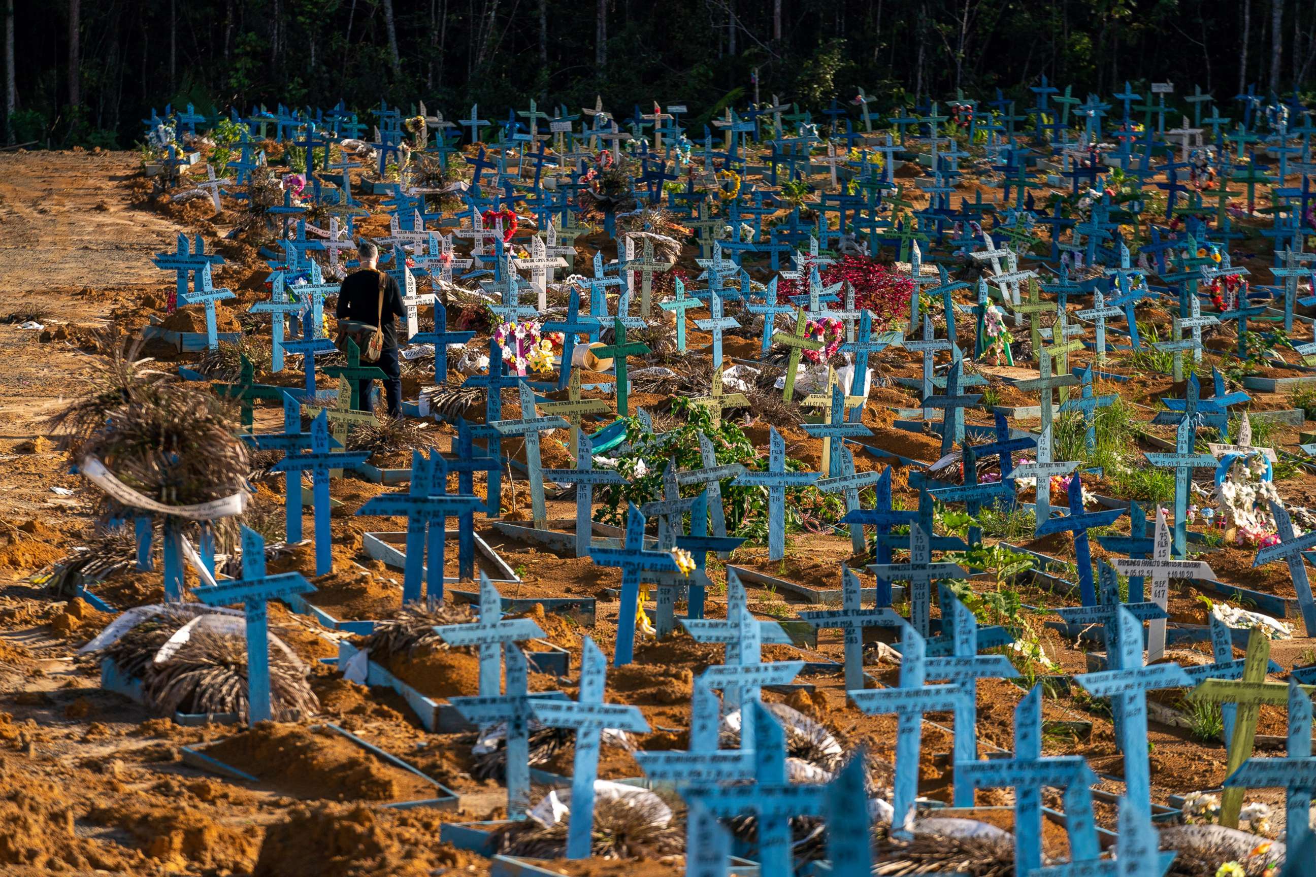 PHOTO: Blue grave markers called "Castilhos" are laid out for people who died of Covid at Nossa Senhora Aparecida public cemetery, March 30, 2021, in Manaus, Brazil.