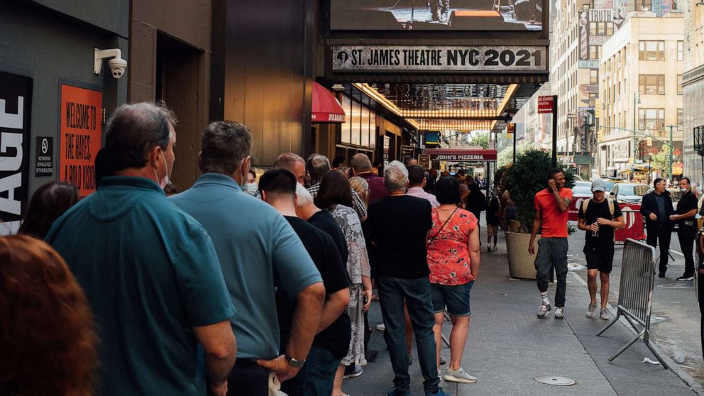 PHOTO: Fans line up outside the St. James Theater, the first venue on the Great White Way to welcome back audiences, on July 10, 2021.