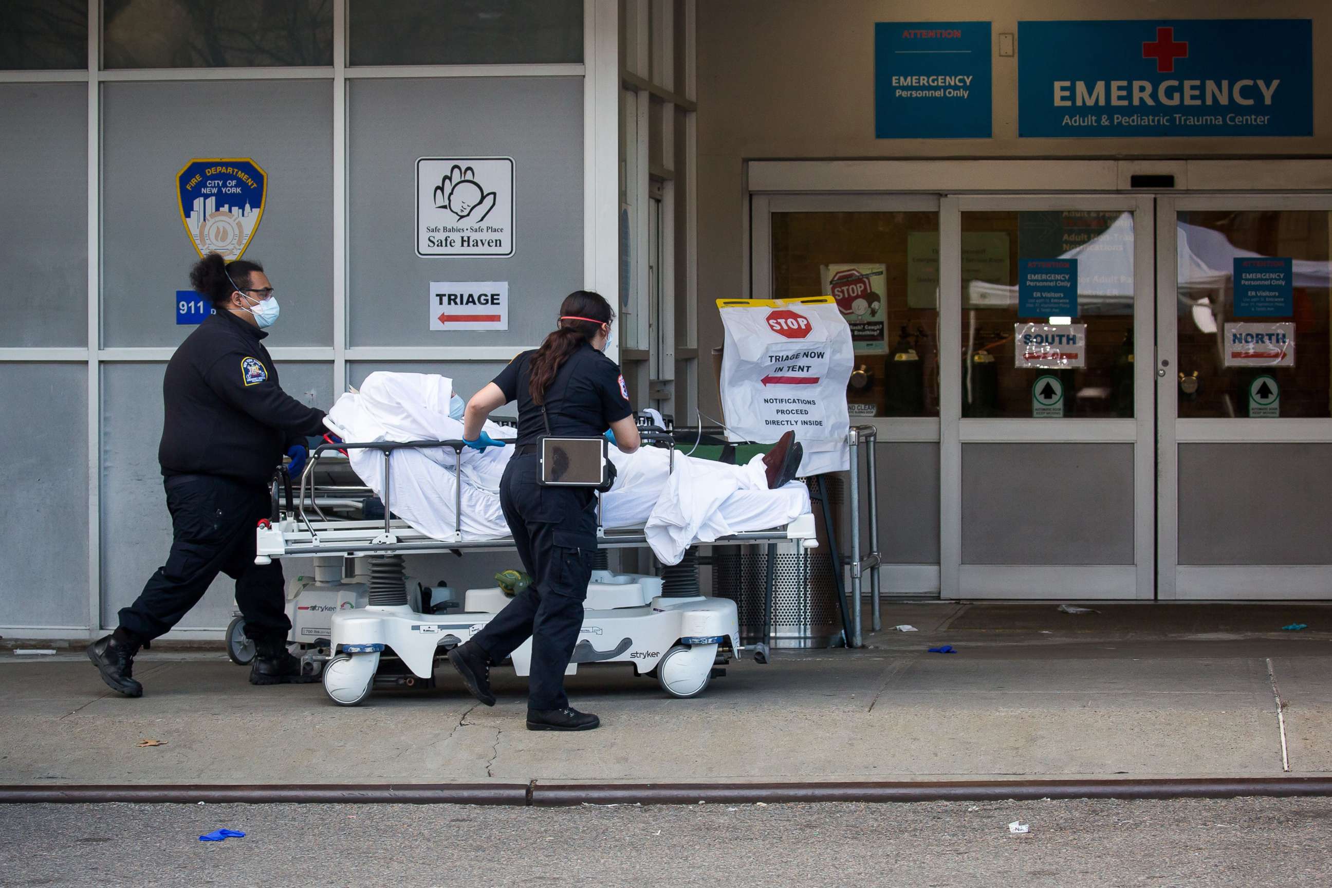 PHOTO: Healthcare workers bring a patient into the emergency room at Maimonides Medical Center during the coronavirus pandemic in Brooklyn, New York, April 8, 2020.