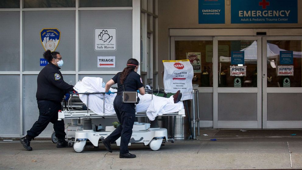 PHOTO: Healthcare workers bring a patient into the emergency room at Maimonides Medical Center during the coronavirus pandemic in Brooklyn, New York, April 8, 2020.