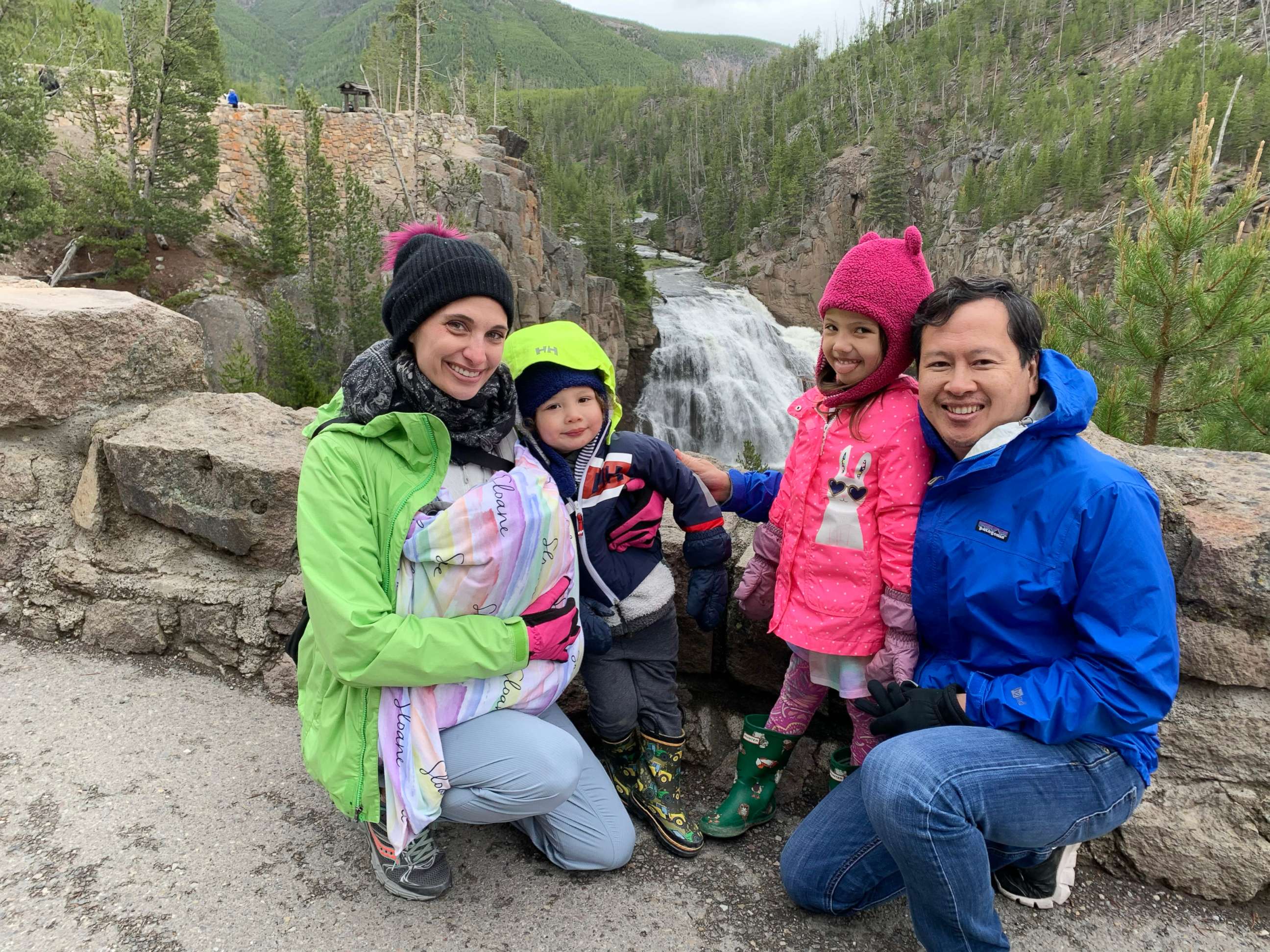 PHOTO:Dr. Erin Biro, left, and Dr. CJ Bui pose with their three children. 