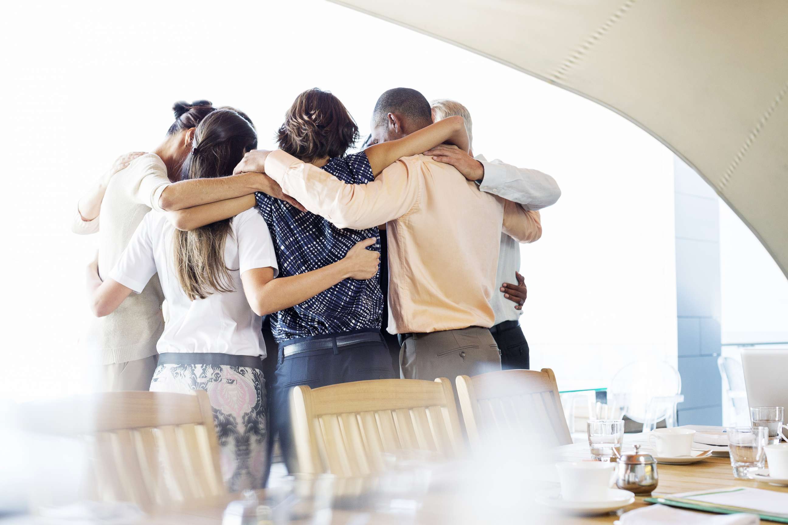 PHOTO: Business people are pictured talking in huddle in this undated stock photo.