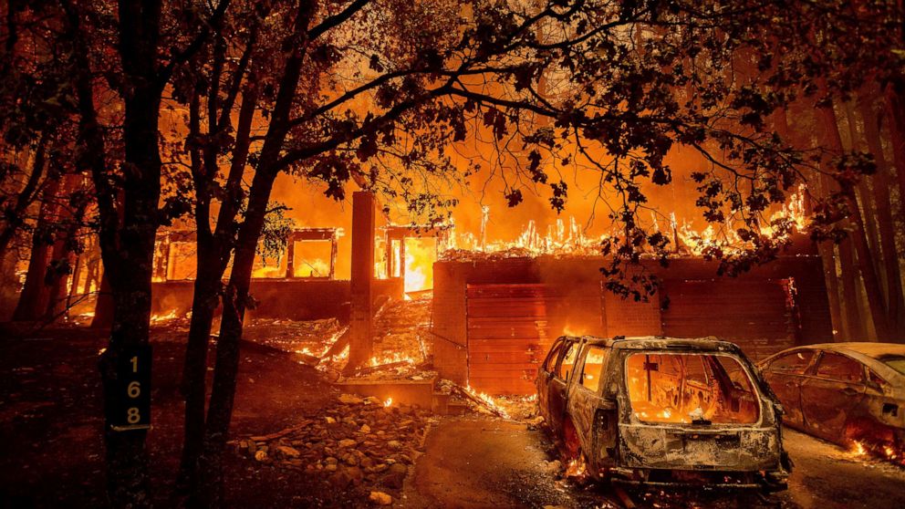 PHOTO: Flames consume a home as the Dixie Fire tears through the Indian Falls community in Plumas County, Calif., July 24, 2021.
