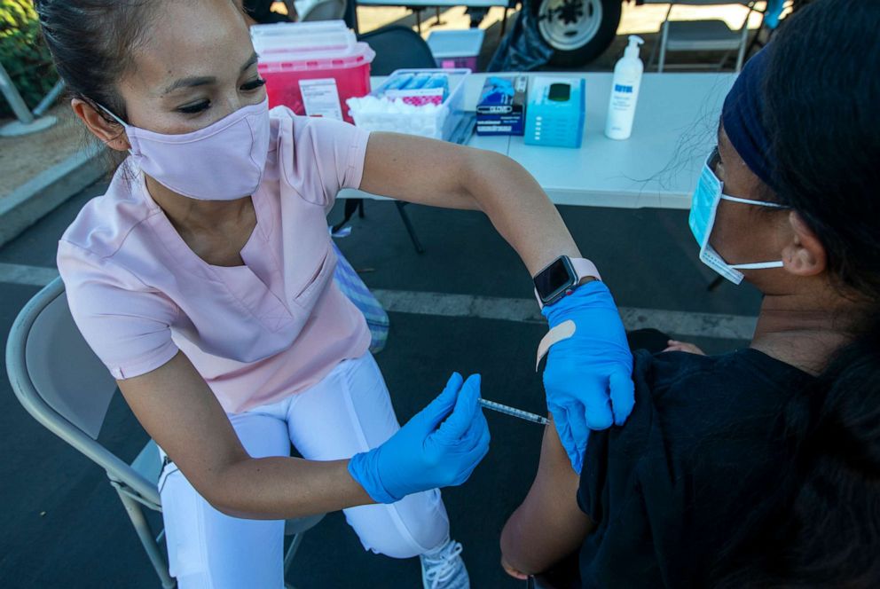 PHOTO: A person gets a COVID-19 vaccine dose in Long Beach, Calif., July 6, 2021.