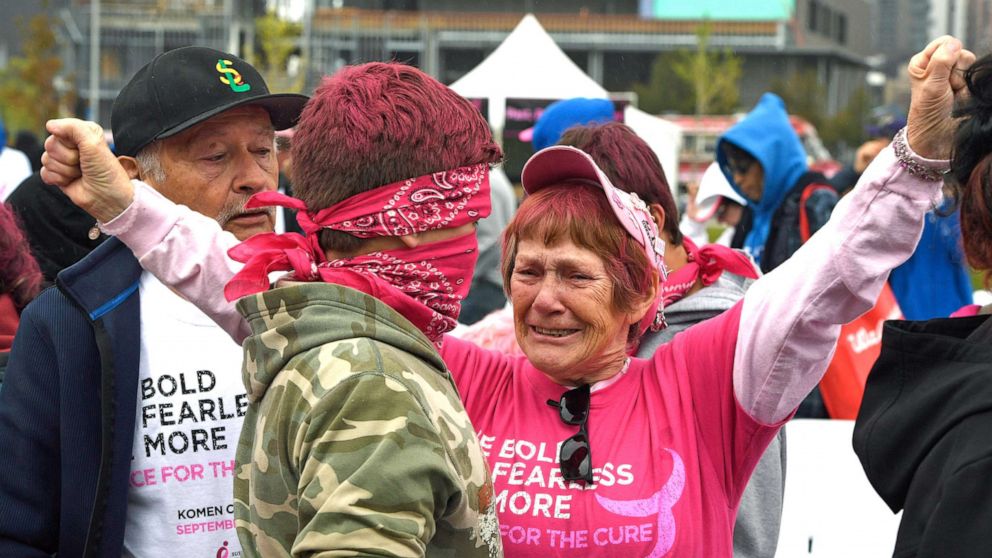 PHOTO: Judy Smith, a two time cancer survivor, gives a big hug to her great grandson  during the Celebration and Survivor Ceremony during the 25th annual Komen Colorado Race for the Cure on Sept. 24, 2017 in Denver.