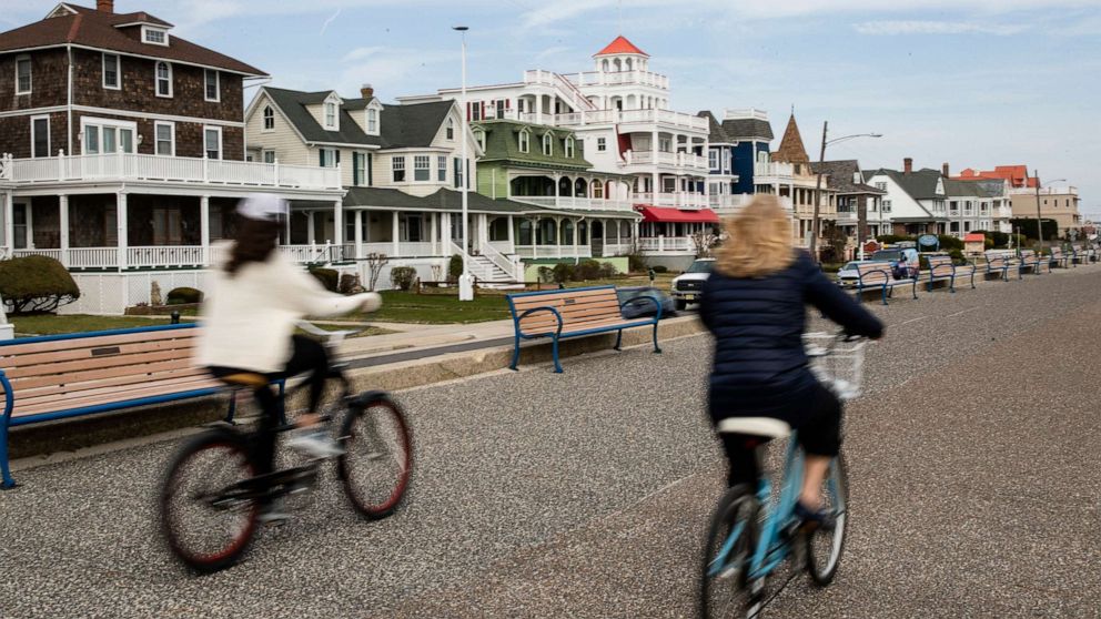 PHOTO: Cyclists ride their bicycles in Cape May, N.J., March 18, 2020. 