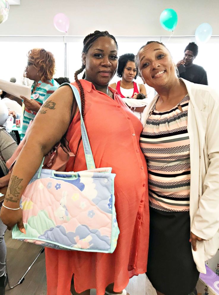 PHOTO: An expectant mom shows off the diaper bag she received at a baby shower at St. Bernard Hospital.