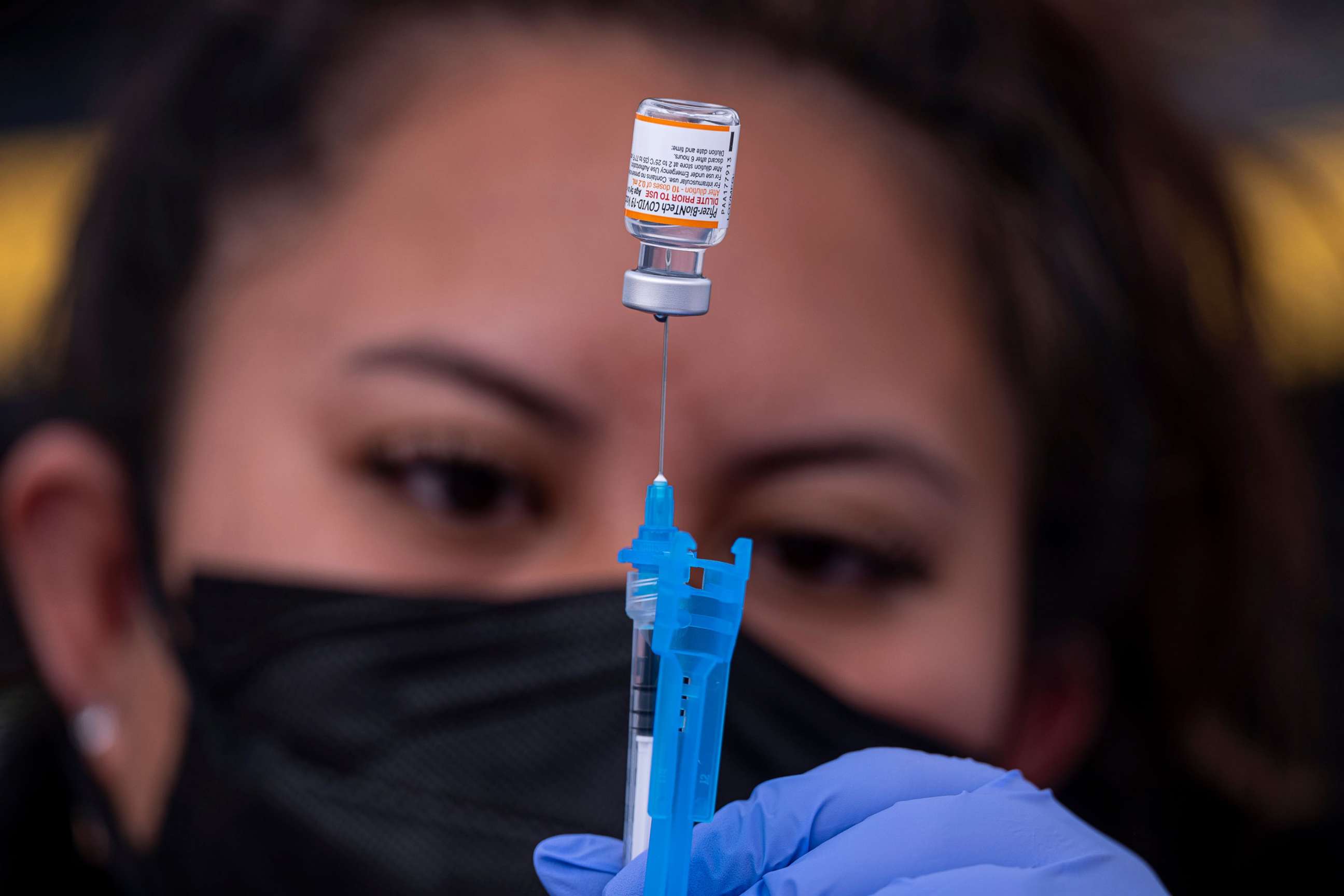 PHOTO: A healthcare worker prepares a dose of Pfizer-BioNTech Covid-19 vaccine at a vaccination site in San Francisco, Jan. 10, 2022.