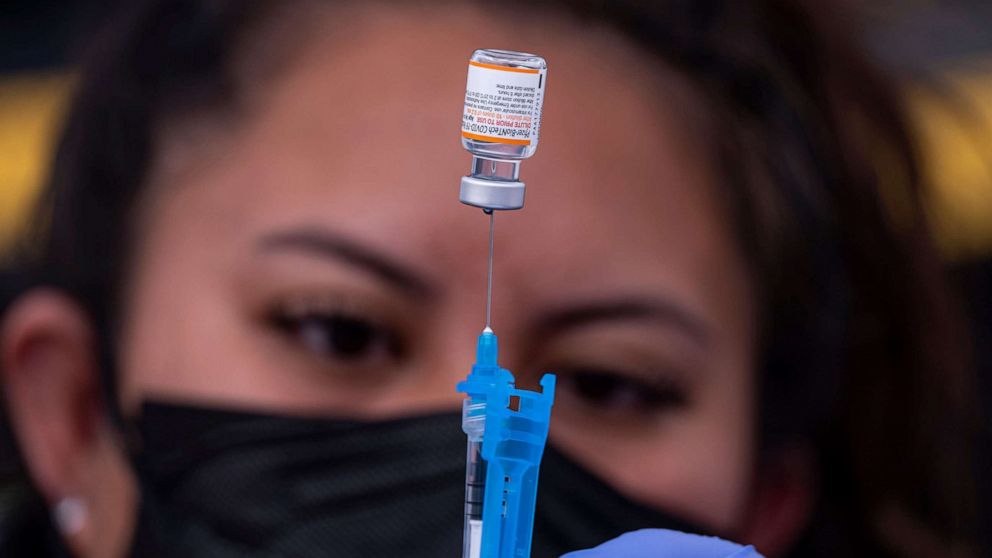 PHOTO: In this Jan. 10, 2022, file photo, a healthcare worker prepares a dose of Pfizer-BioNTech Covid-19 vaccine at a vaccination site in San Francisco.