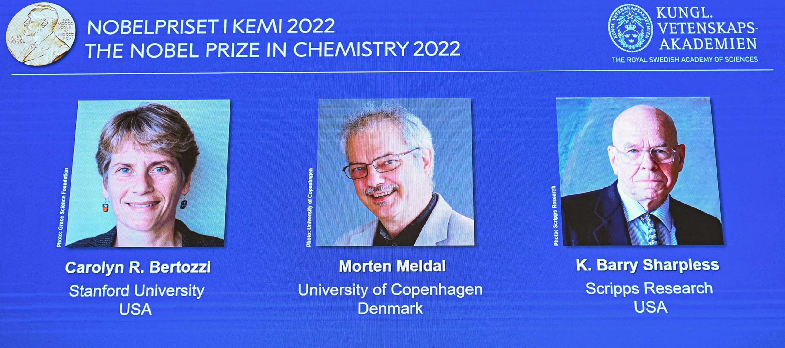 PHOTO: A display shows the winners of the 2022 Nobel Prize in Chemistry, US's Carolyn Bertozzi (L) and Barry Sharpless (R), and Denmark's Morten Meldal (C) during a press conference at the Royal Swedish Academy of Sciences in Stockholm, on Oct. 5, 2022. 