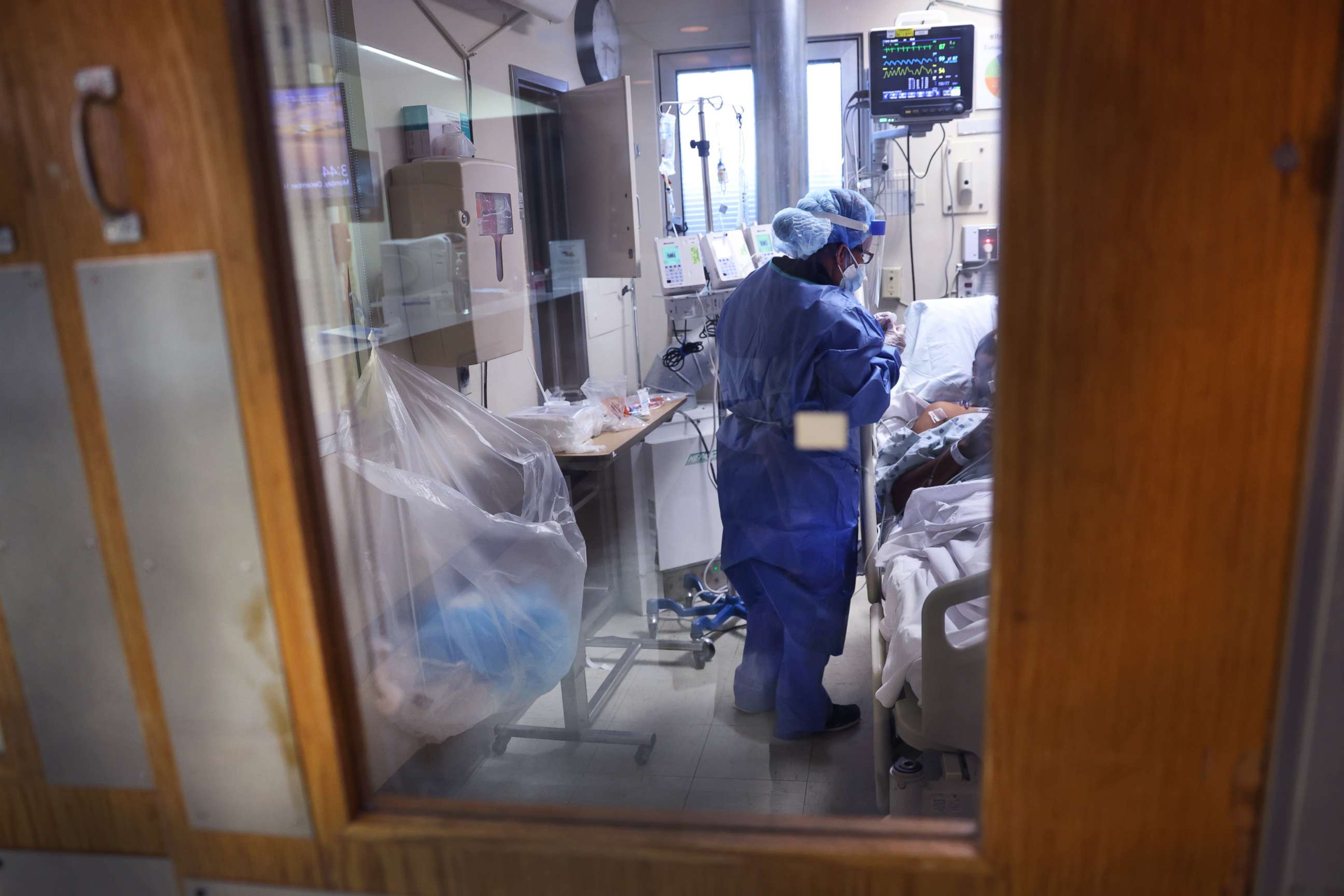 PHOTO: Intensive Care Unit nurse Meriem Saleh treats a COVID-19 patient in the ICU at Roseland Community Hospital, Dec. 14, 2020, in Chicago. 