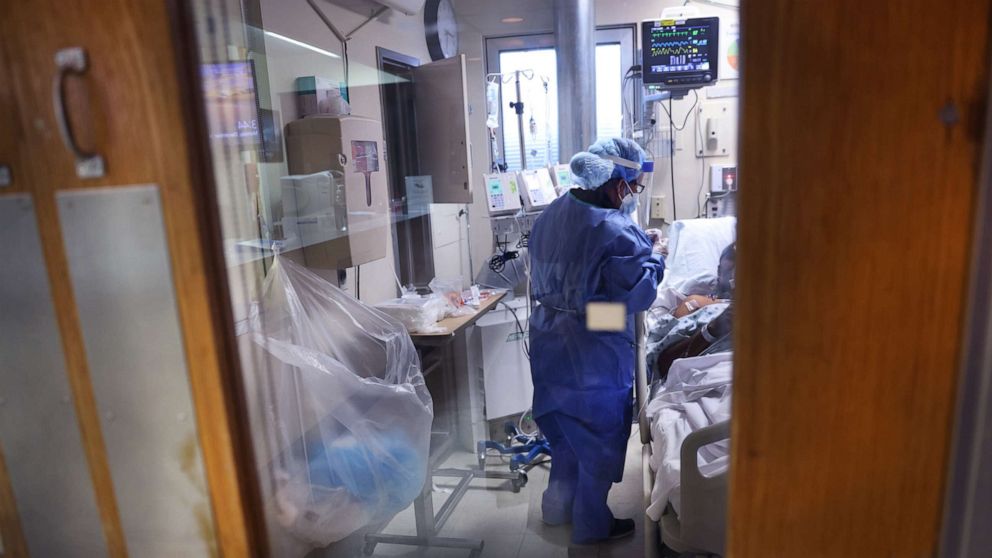 PHOTO: Intensive Care Unit nurse Meriem Saleh treats a COVID-19 patient in the ICU at Roseland Community Hospital, Dec. 14, 2020, in Chicago. 